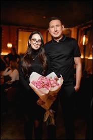 A person and person holding a cake

Description automatically generated with low confidence